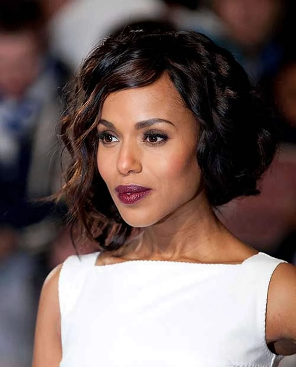 4. Side-parted Asymmetrical curly Bob