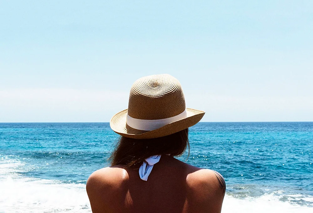 Woman in a hat on the Beach