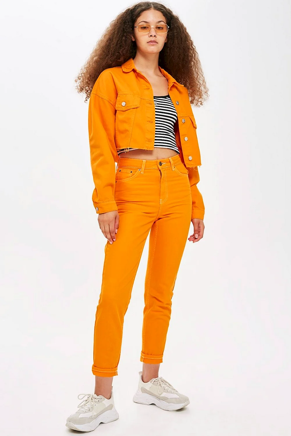 Оранжевые джинсы женские